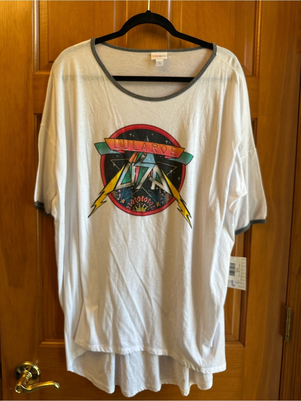 LuLaRoe Irma White Short Sleeve Graphic Tee with Multicolor Retro Emblem